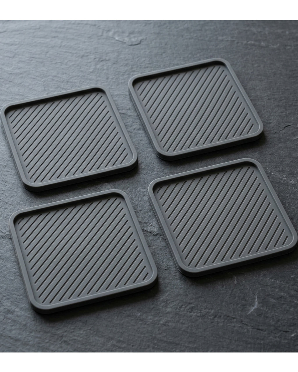 Plvqx Square Silicone Coasters Four Piece Charcoal - Lifestyle view