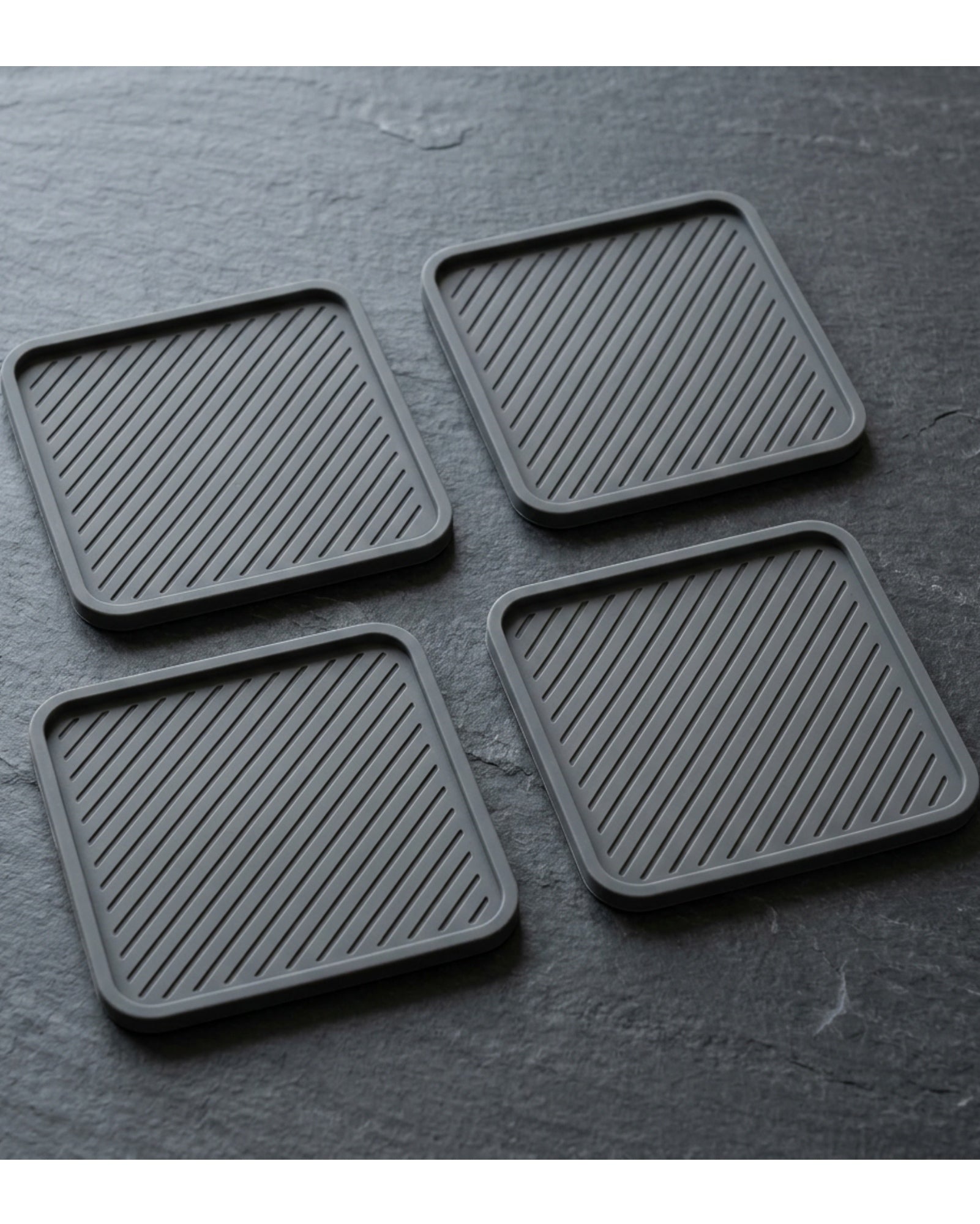 Plvqx Square Silicone Coasters Four Piece Charcoal - Lifestyle view